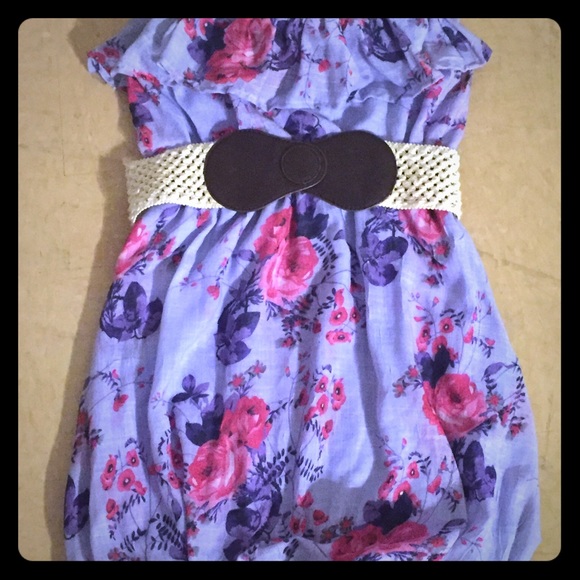 Purple and pink flowered strapless dress.