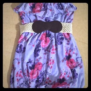 Purple and pink flowered strapless dress.