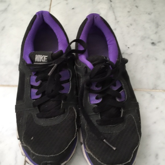 Nike tennis shoes-purple and black grey swoosh.