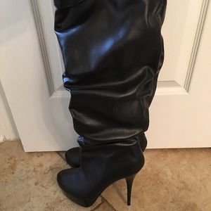 Black, tall stiletto boots. Only been worn twice.