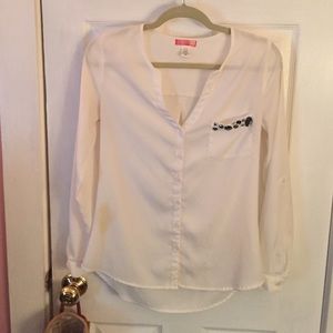 Off white long sleeved chiffon top with a pocket