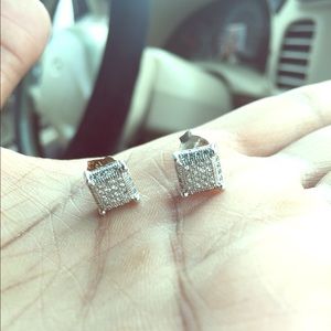 Silver and diamond encrusted earrings.