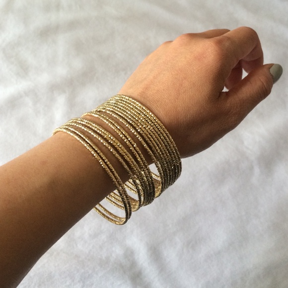 Gold tone bangles (15 total) 2in in diameter