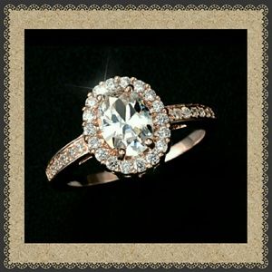 18k rose gold plated ring cz center stone. Size 9.