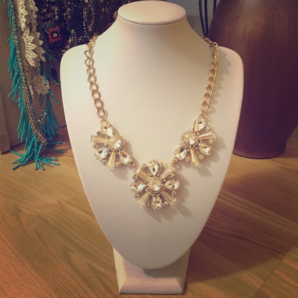 Gold statement necklace with cubic zirconia.