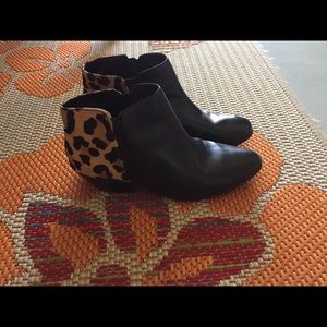 Black leather ankle boots with calf design