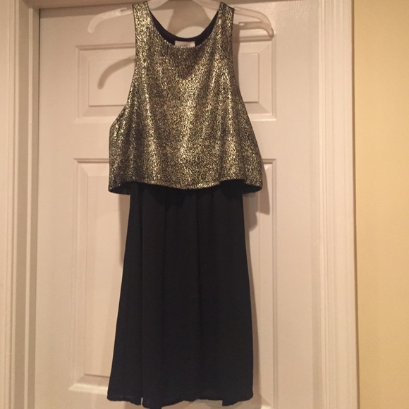 Elegant black and gold dress. Size: M. Brand new.