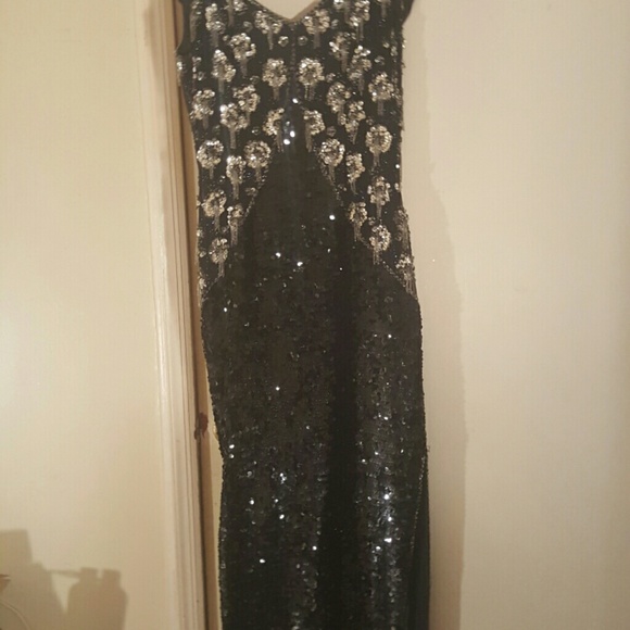 Hand beaded dress with a left leg split to thigh ,