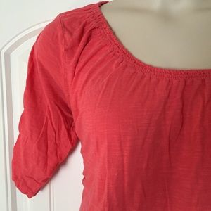 Coral colored scoop neck with rouched sleeves