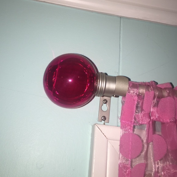 3 Pink ball curtain rods.