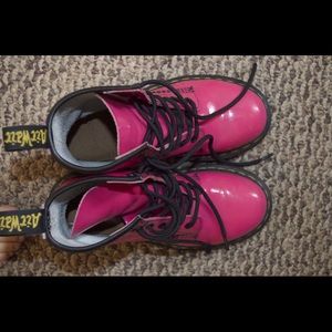 Dr. Martens in hot pink, lightly worn