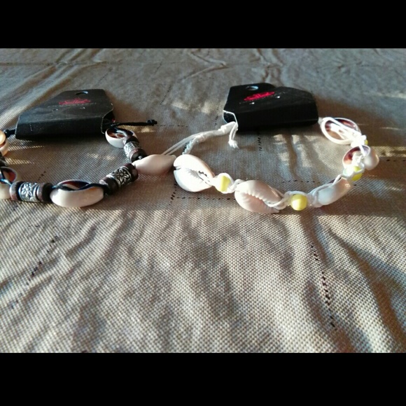 2 anklets or bracelets