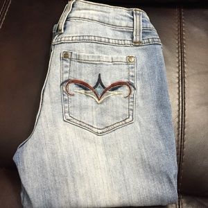 Blue jean capris that have the distressed look