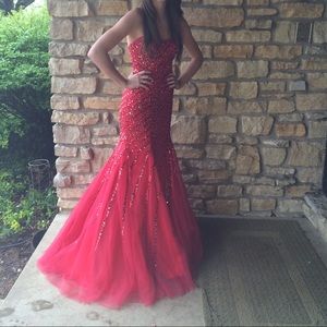 Red sequined corset prom dress.