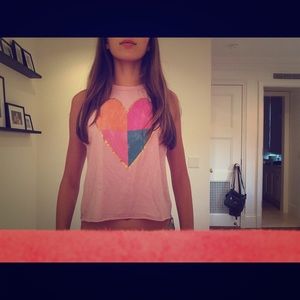 A light pink muscle tank with a heart on it