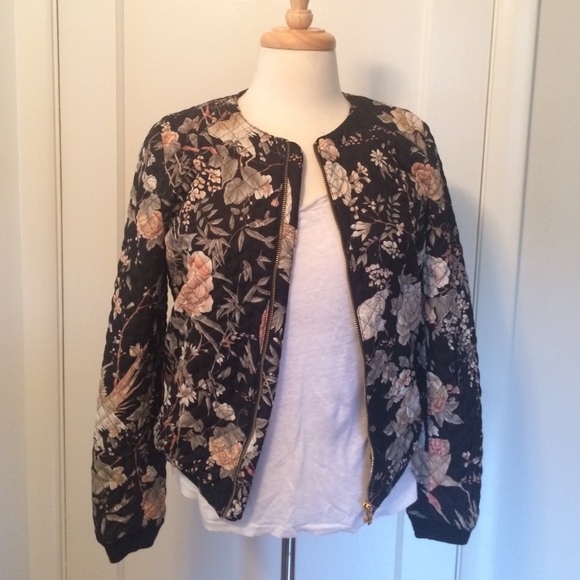 Floral quilted bomber with golf zipper.