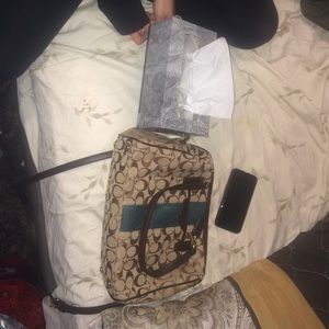 Never used coach purse with blue stipe down front