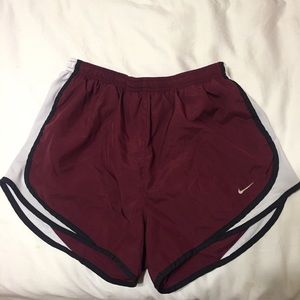 maroon Nike running shorts