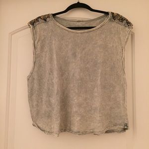 Gray sleeveless top with embellished shoulders