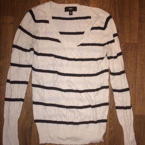 Swoop neck black and white striped sweater.