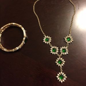 Gold and emerald necklace and bracelet set