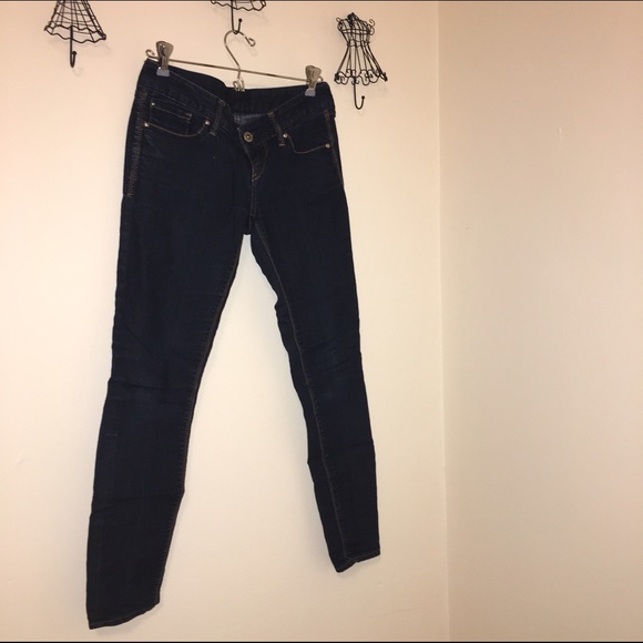 Express dark blue skinny legging jeans.