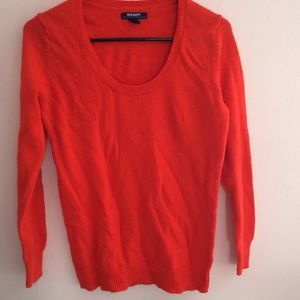 Bright orange sweater