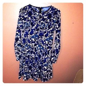 A dress with long sleeves and floral pattern