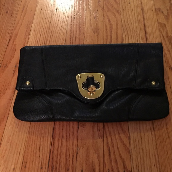 Black clutch with a gold buckle closure