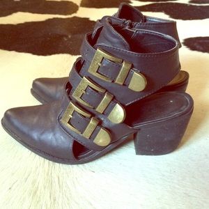 Black pointed toe leather boots