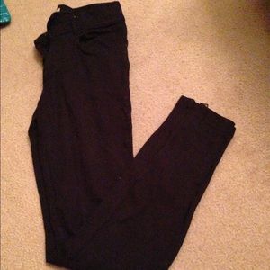 Black Burberry pants with zippers at the bottom