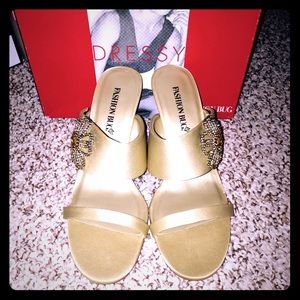 Gold sandal with beautiful flower detail.