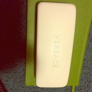 White and gold Versace sunglasses case.