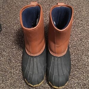 Brown and black duck boots