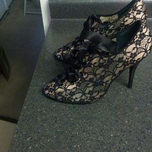 Lace shoes with ribbon laces. Never worn.