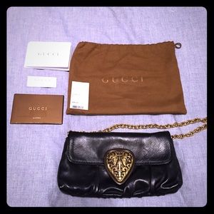Black leather Gucci clutch