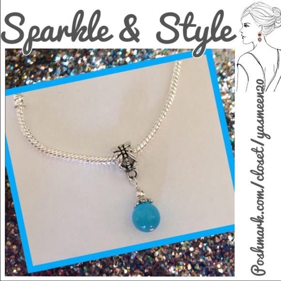 Light blue round cat's eye charm