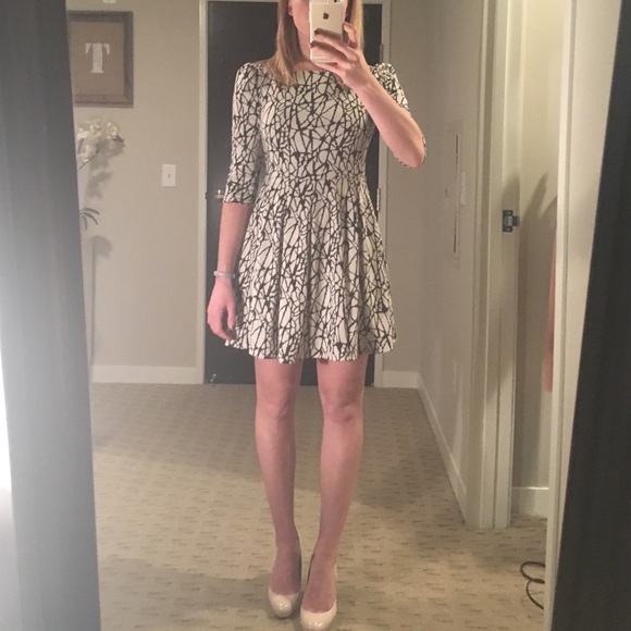Beige and black fit and flare dress
