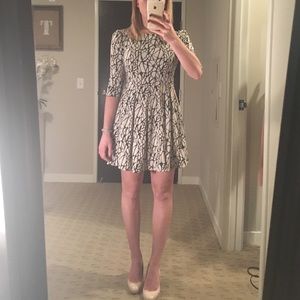 Beige and black fit and flare dress