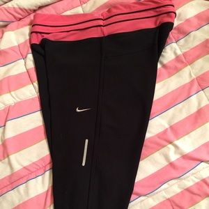 pink and black Nike workout crops