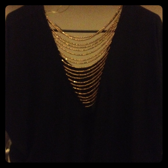 Black loose blouse (golden beads in the back)