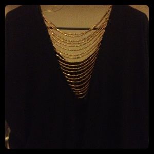 Black loose blouse (golden beads in the back)