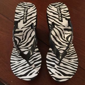 Bebe wedge flipflops. New without tag