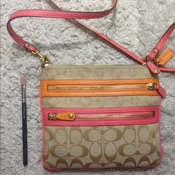 Pink and orange crossbody coach purse