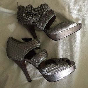 Poetic License silver pumps