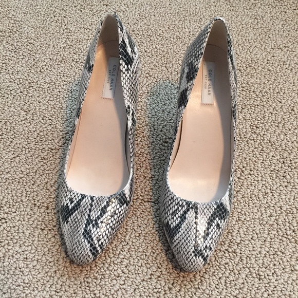 Leather Python print round toe heels.