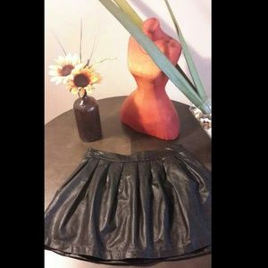 Black faux leather mini skirt.