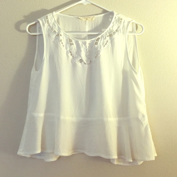 White sleeveless top.