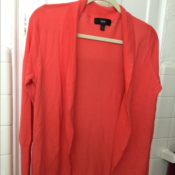 Coral color lightweight sweater.