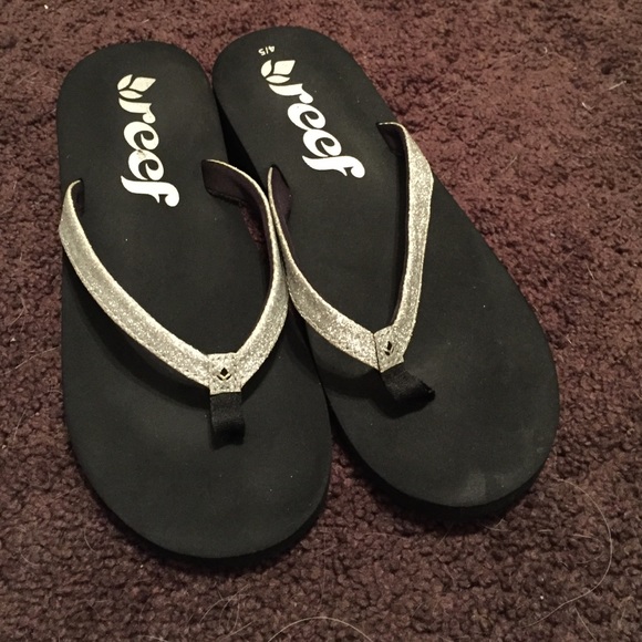 Silver and black Reef flip flops